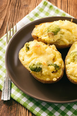 Twice baked potatoes stuffed with broccoli, sour cream and cheese.