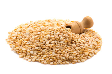 Yellow peas with a shovel on a white background