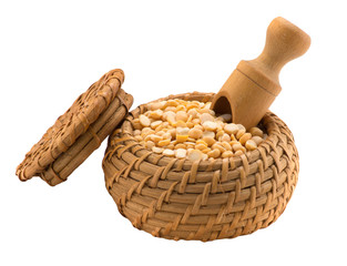 Yellow peas in a wooden bowl with a spatula