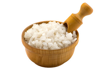 Sea salt with wooden spoon in a wooden bowl
