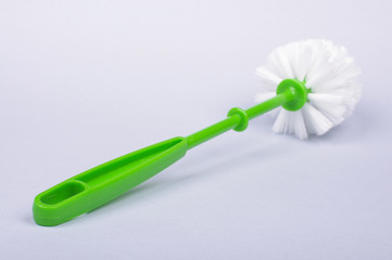 Toilet brush with green handle isolated