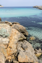 Fototapeta na wymiar Rocks by the Mediterranean sea on the island of Ibiza in Spain,