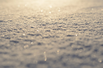 Background of natural snow texture at sunset