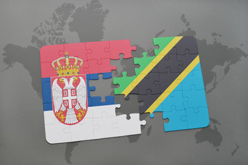 puzzle with the national flag of serbia and tanzania on a world map