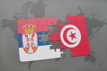 puzzle with the national flag of serbia and tunisia on a world map