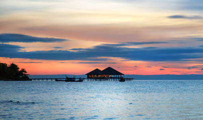 Water cafe at sunset - Maldives vacation background