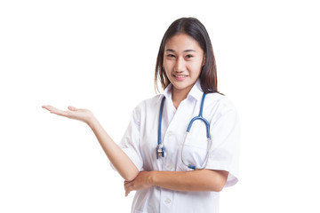 Asian young female doctor show something on her hand.