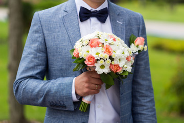 The groom at a wedding in a blue jacket