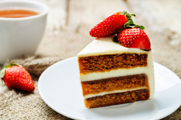 Carrot cake decorated with strawberries