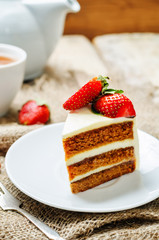 Carrot cake decorated with strawberries