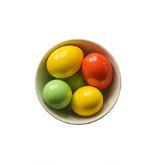 colored eggs. Painted colorful eggs in bowl. Feast of Easter. Isolated objects. View from above, copy space.