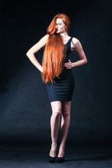 Beauty ginger Girl Portrait. Healthy Long Red Hair. Beautiful Yo