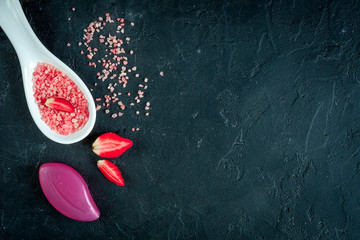 Fototapeta premium organic cosmetics with extracts of berries dark background top view