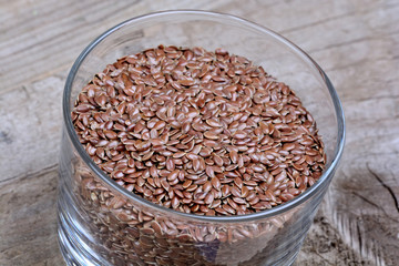 Flax seeds in a glass on table