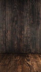 Dark brown wooden table and background for product placement with copy space