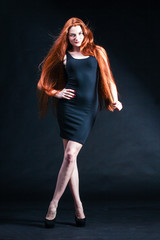 Fototapeta na wymiar Beauty ginger Girl Portrait. Healthy Long Red Hair. Beautiful Yo