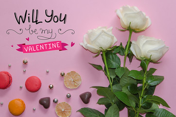St Valentine's Day vintage composition of white roses, macarons and lettering