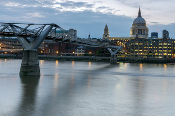 Fototapeta na wymiar LONDON, ENGLAND - JUNE 17 2016: Twilight panorama of Millennium Bridge and St. Paul Cathedral, London, Great Britain