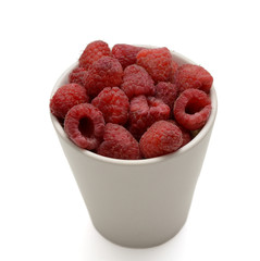 Fresh Raspberries in a Cup Isolated On White Background