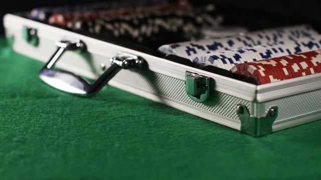 4K Silver case being opened containing gambling poker chips
