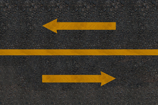 Cross arrows  printed on the road , direction concept