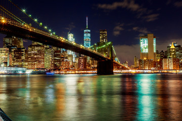 Fototapeta na wymiar Brooklyn bridge and New York city skyline at night taken