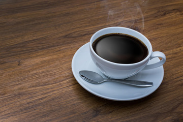 White cup of coffee on vintage wood. Top view ,  cup on wooden t