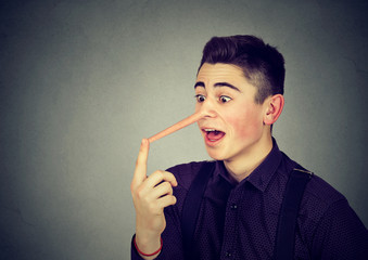 Obraz premium Man with long nose. Liar concept.
