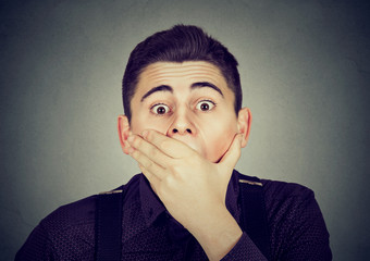 portrait of surprised young shocked man.