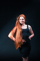 Beauty ginger Girl Portrait. Healthy Long Red Hair. Beautiful Yo