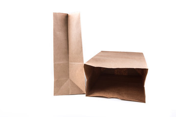 Plain brown paper shopping bag isolated on a white background