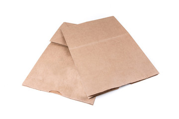 Plain brown paper shopping bag isolated on a white background