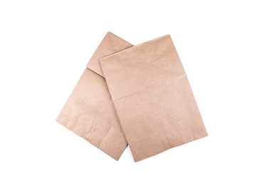 Plain brown paper shopping bag isolated on a white background