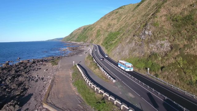 Traffic on Kapiti coastline scenic highway, New Zealand aerial view 