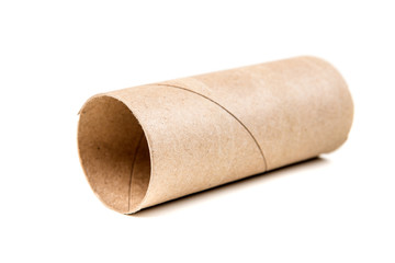 Single empty toilet paper roll isolated on a white background