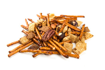 Homemade baked cereal mix with nuts isolated on a white background