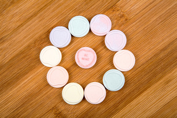 Blank valentine candy hearts isolated on a wood background