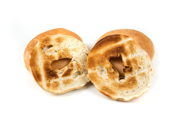 Plain white toasted bagels isolated on a white background
