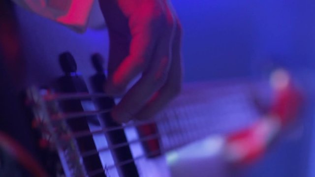 Guitars in live action at a concert (rack focus)