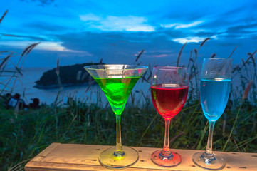 a lady gathering with some drinks
on hilltop in front of wind turbine view point near Phomthep cape viewpoint from wind turbine view point can see the island 