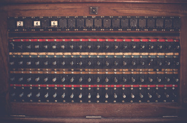 Antique vintage telephone switch board, telecommunication wood box. Old telecommunication concept.