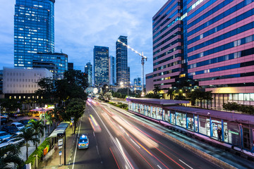 Fototapeta na wymiar Traffic rushing in Jakarta business district in Indonesia capital city