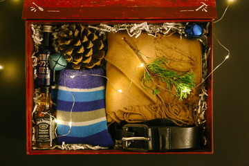 Gift for a man. A set of scarves, socks, belt, bumps, Jack Daniels and Vodka