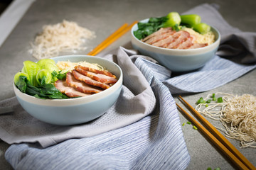 delicious egg noodle with red pork and vegetable in bowl decorat