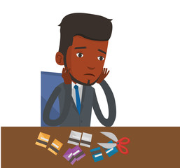 Businessman bankrupt cutting his credit card.