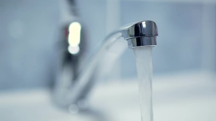 Silver faucet water drips dripping