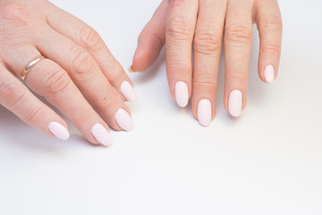 Amazing manicure and natural nails with gel polish. Attractive modern nail art design.