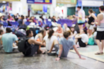 Blurred background of travelers waiting train in station