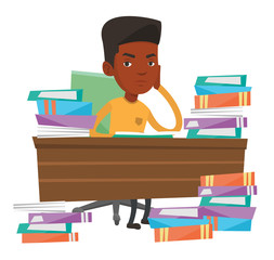 Student sitting at the table with piles of books.