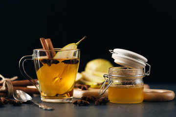 pear punch with sliced fruits and cinnamon